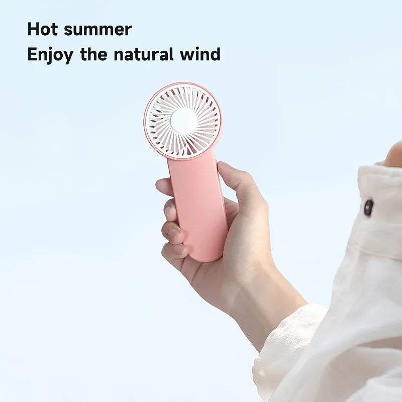 Portable Handheld Mini Fan,Powered by AA Batteries,Adjustable Single Speed, Ideal for Outdoor Use,Lightweight and Compact Design