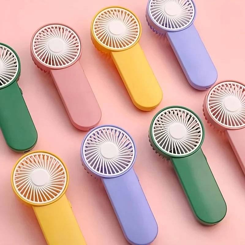 Portable Handheld Mini Fan,Powered by AA Batteries,Adjustable Single Speed, Ideal for Outdoor Use,Lightweight and Compact Design